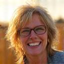 Jessica Thompson, a woman in her 40s smiling genuinely outdoors
