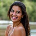 Maria Rodriguez, a Latina woman in her 30s with a bright, adventurous look